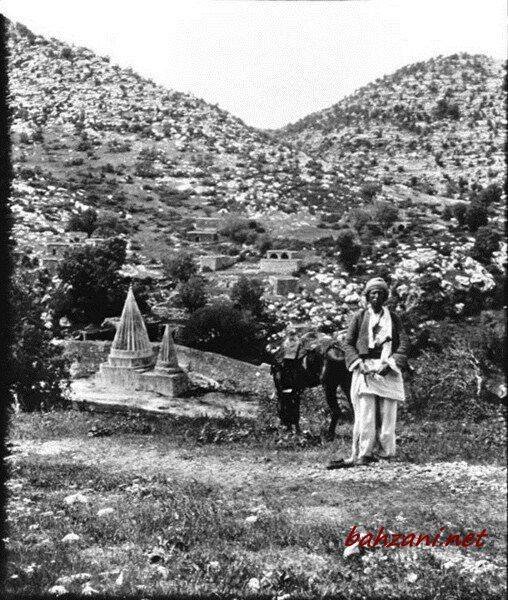 A Yazidi standing near a temple