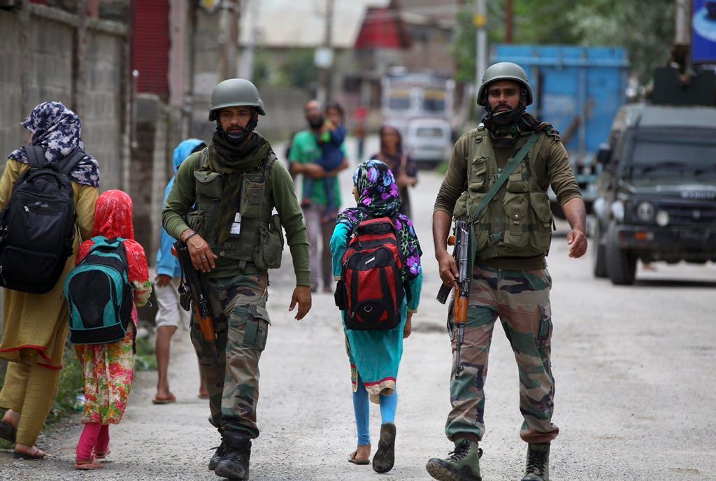 Kids going to School in Kashmir under the protection of Paramilitary.